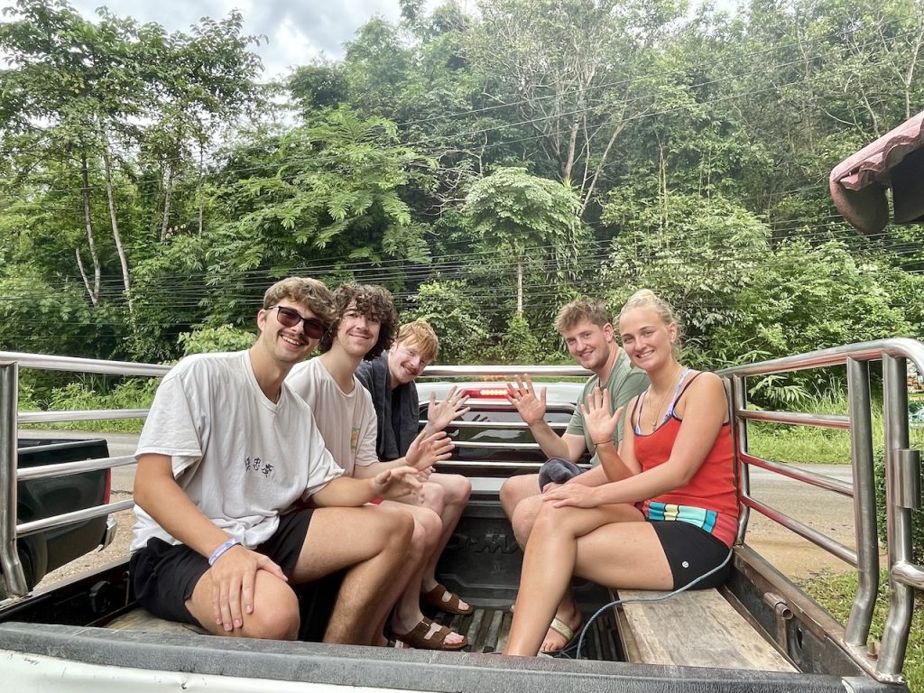 Tourists riding in a pickup truck in Khao Sok National Park.