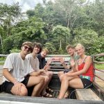 Tourists riding in a pickup truck in Khao Sok National Park.