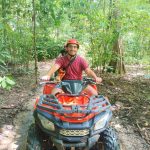 A client rides an ATV in Khao Sok.