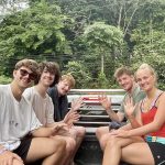 Tourists riding in a pickup truck in Khao Sok National Park.